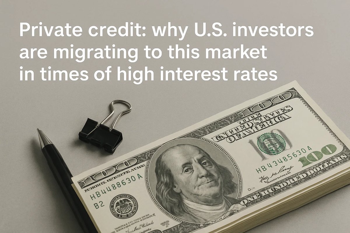 Close-up of a stack of one-hundred-dollar bills with a pen and paper clip on a gray surface, illustrating the concept of U.S. investors turning to private credit amid high interest rates.